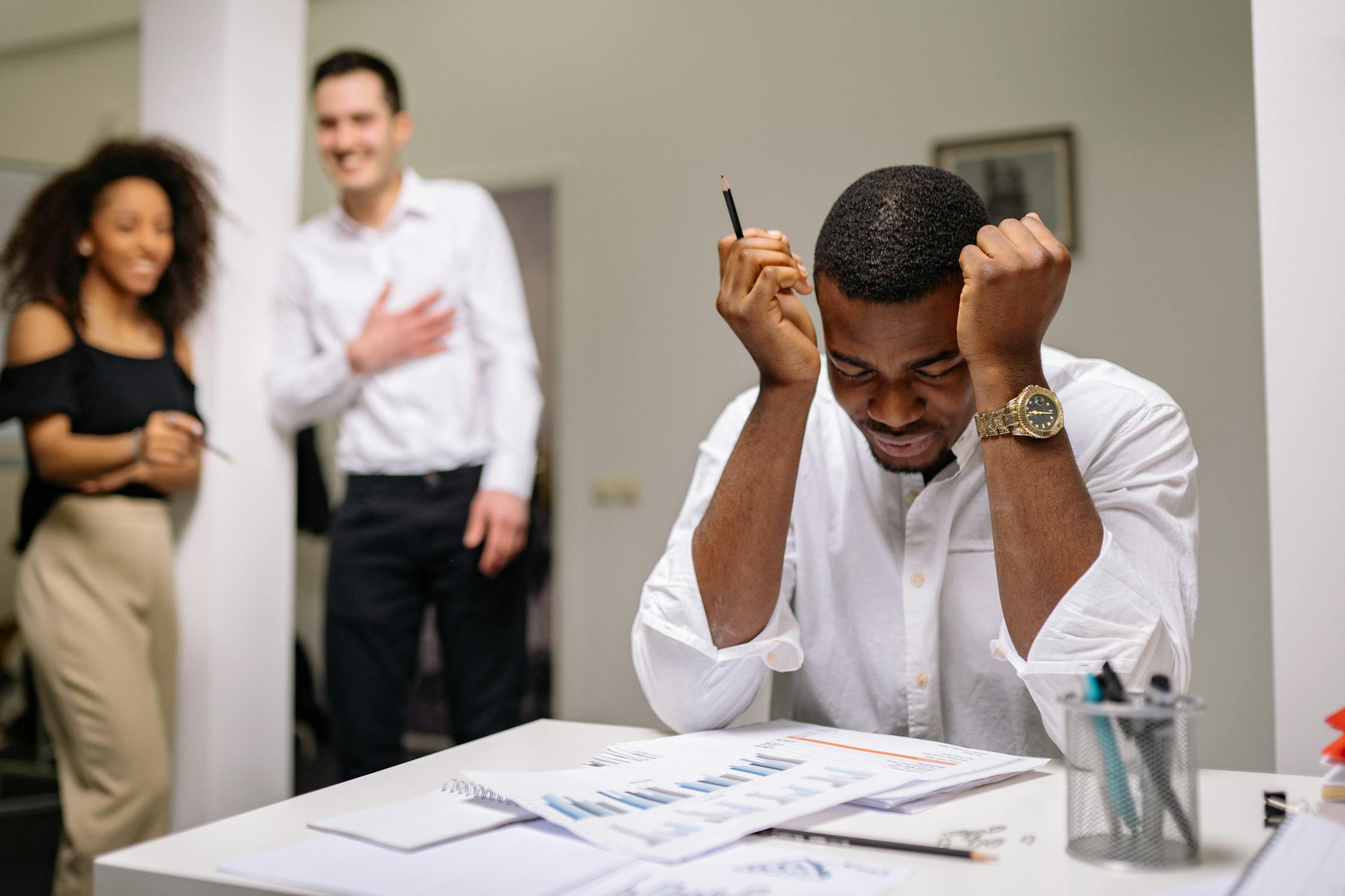 Teacher managing paper records at a Ghanaian school