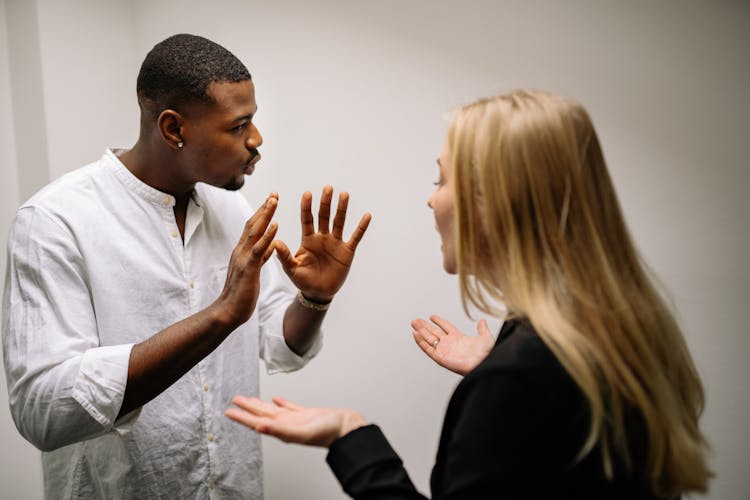 Man In White Dress Shirt Holding Womans Face