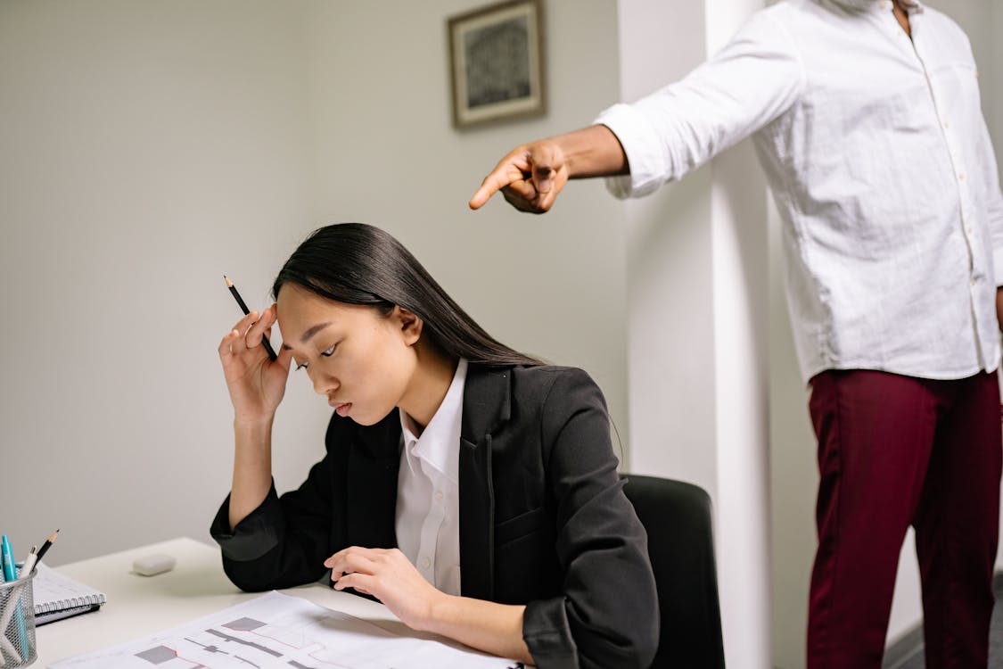 Free Woman in Black Blazer Writing on White Paper Stock Photo