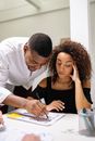 Man in White Dress Shirt Sitting Beside Woman in Black Tank Top