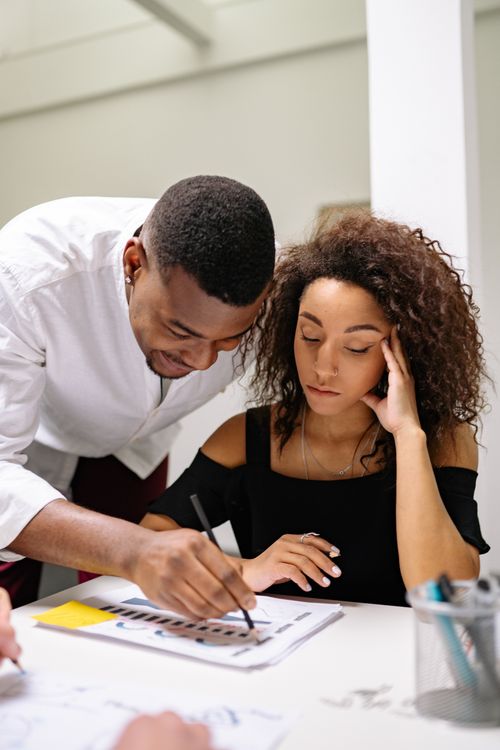 Free Two business colleagues work together on a project in a contemporary office setting. Stock Photo