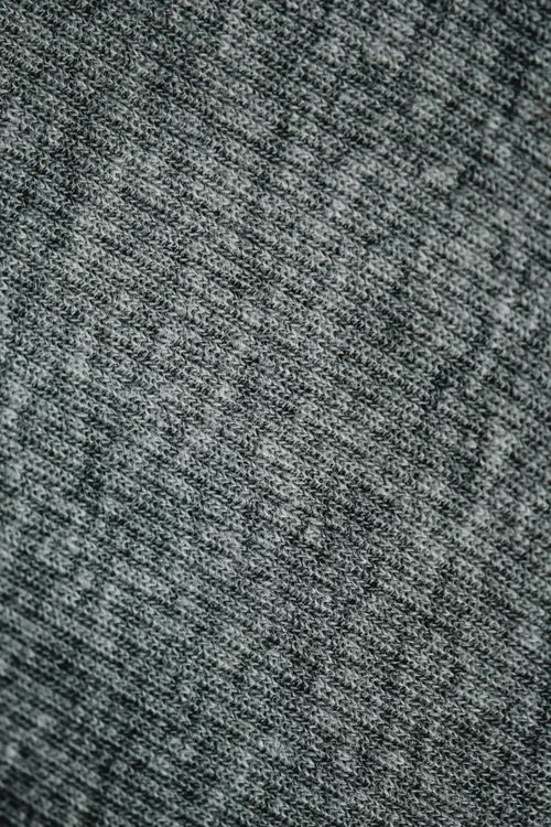 Free Detailed view of gray knitted fabric texture, perfect for textile and fashion uses. Stock Photo