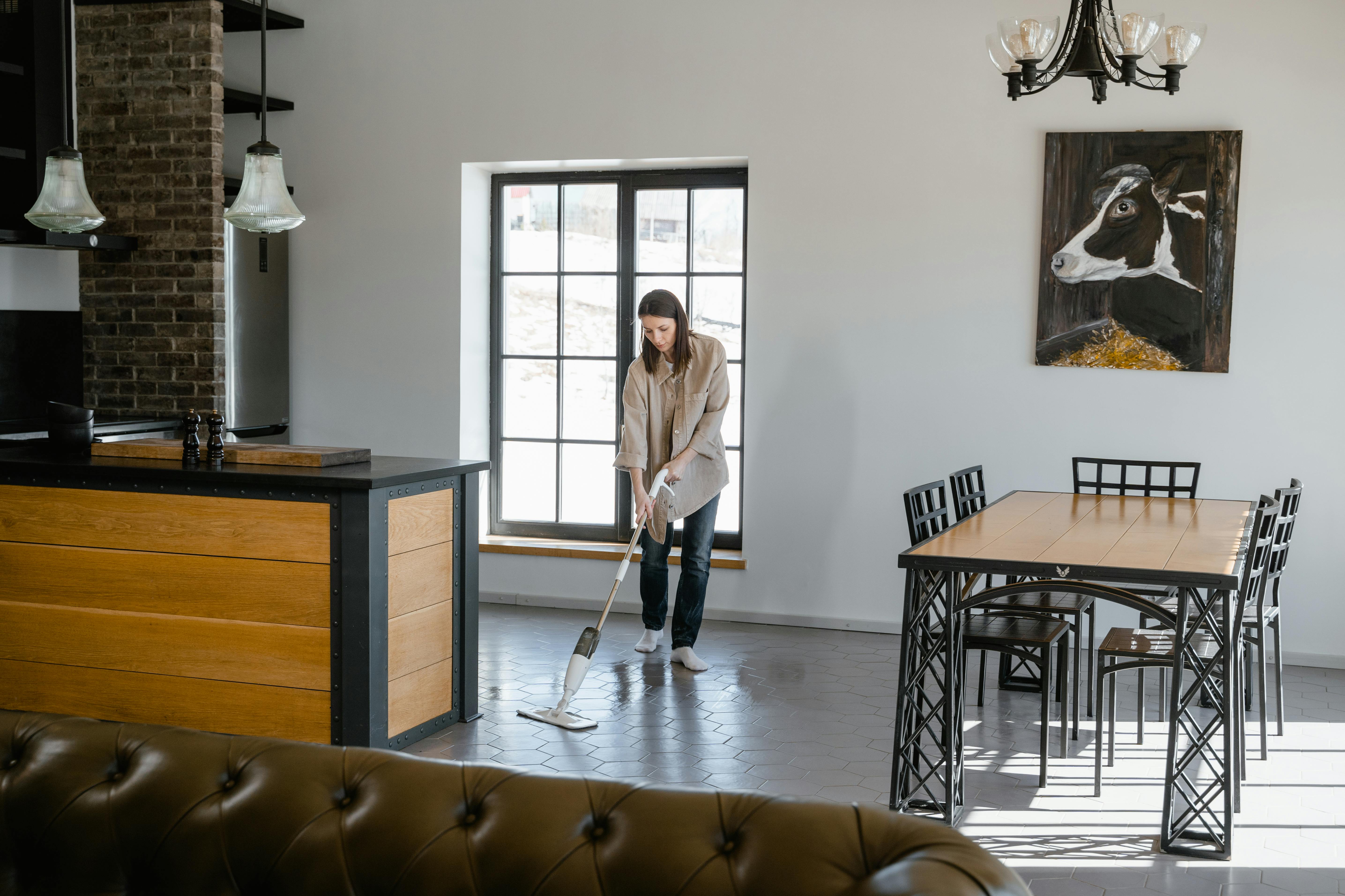 a woman cleaning the floor