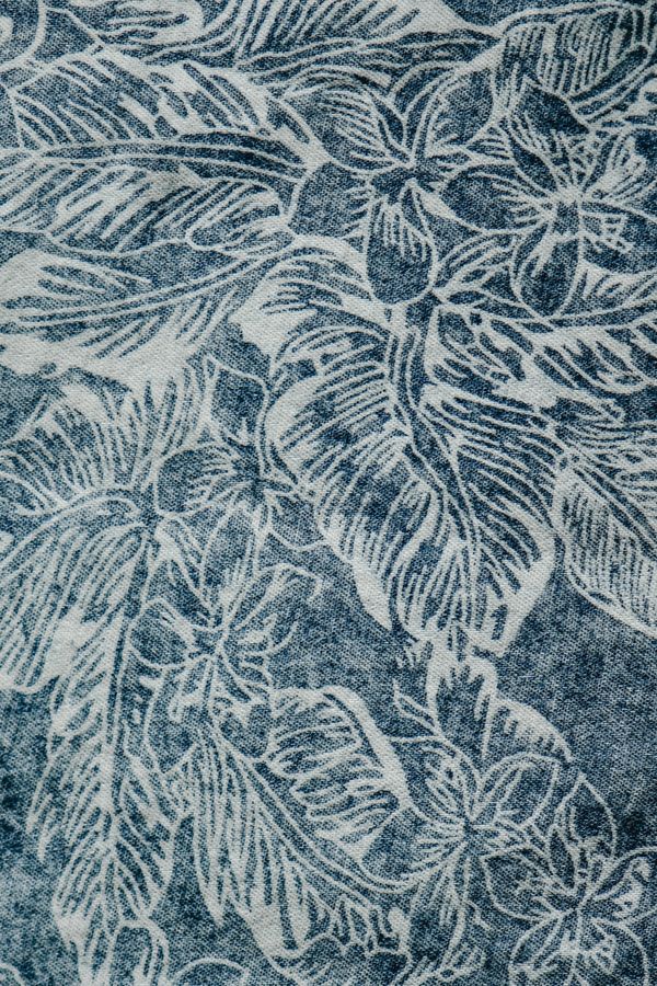 Blue and white floral pattern on fabric — photo by Eva Bronzini on Pexels