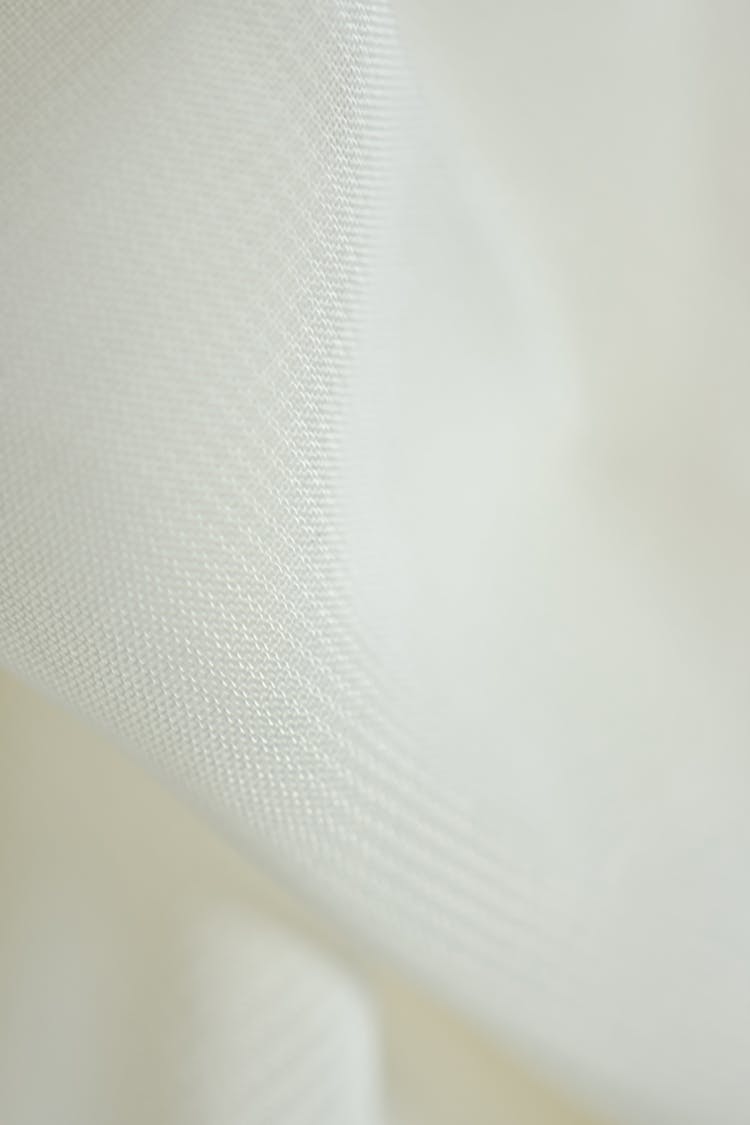 White Textile In Close-up Shot