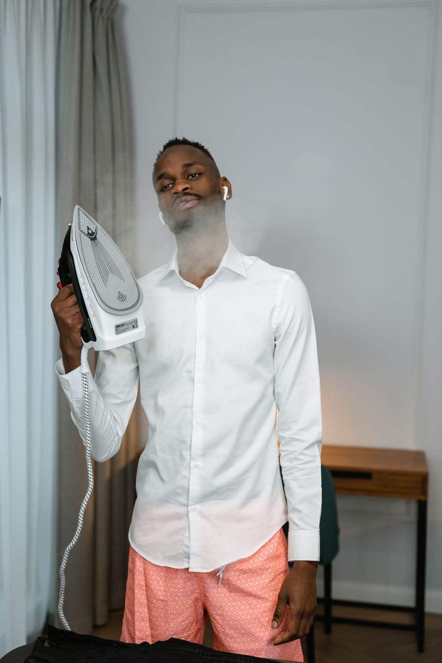 Professional Ironing Qurtubah – garment being steam ironed