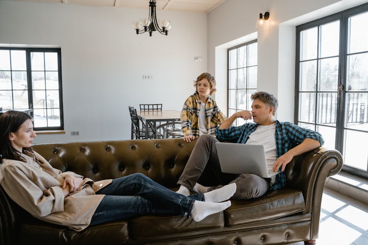 A Family Relaxing On The Living Room