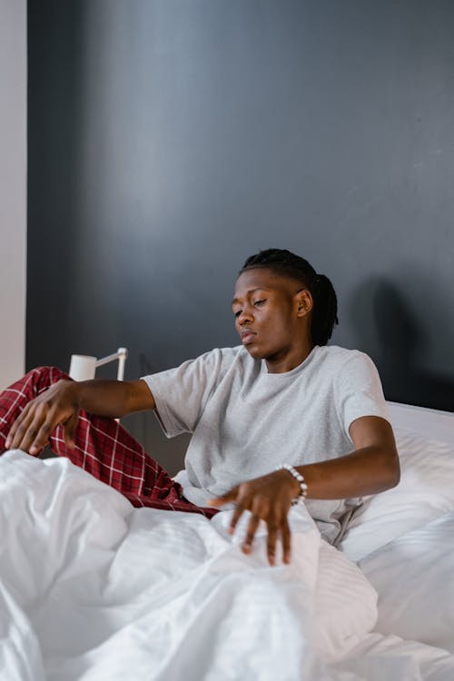 Free A Man Getting Up from the Bed Stock Photo