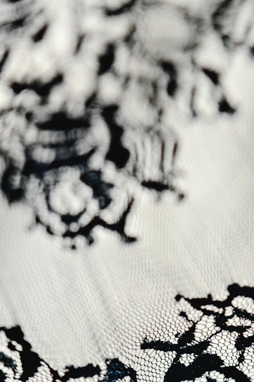 Black Embroidery on White Textile