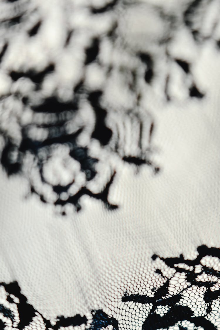 Black Embroidery On White Textile