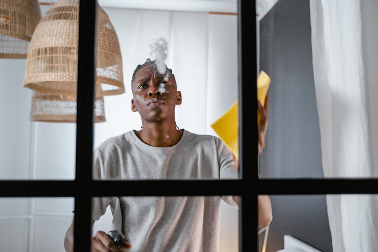 Man In Crew Neck T-Shirt Cleaning The Window 