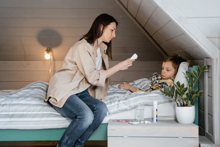 A Mother Caring For Her Sick Son