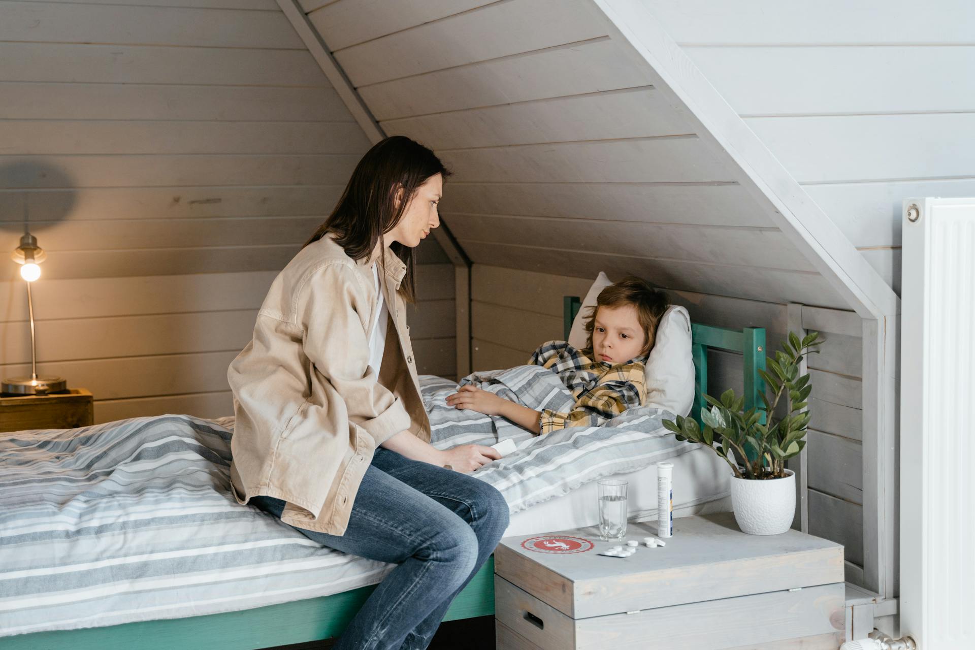 Worried Mother Takes Care of Sick Child