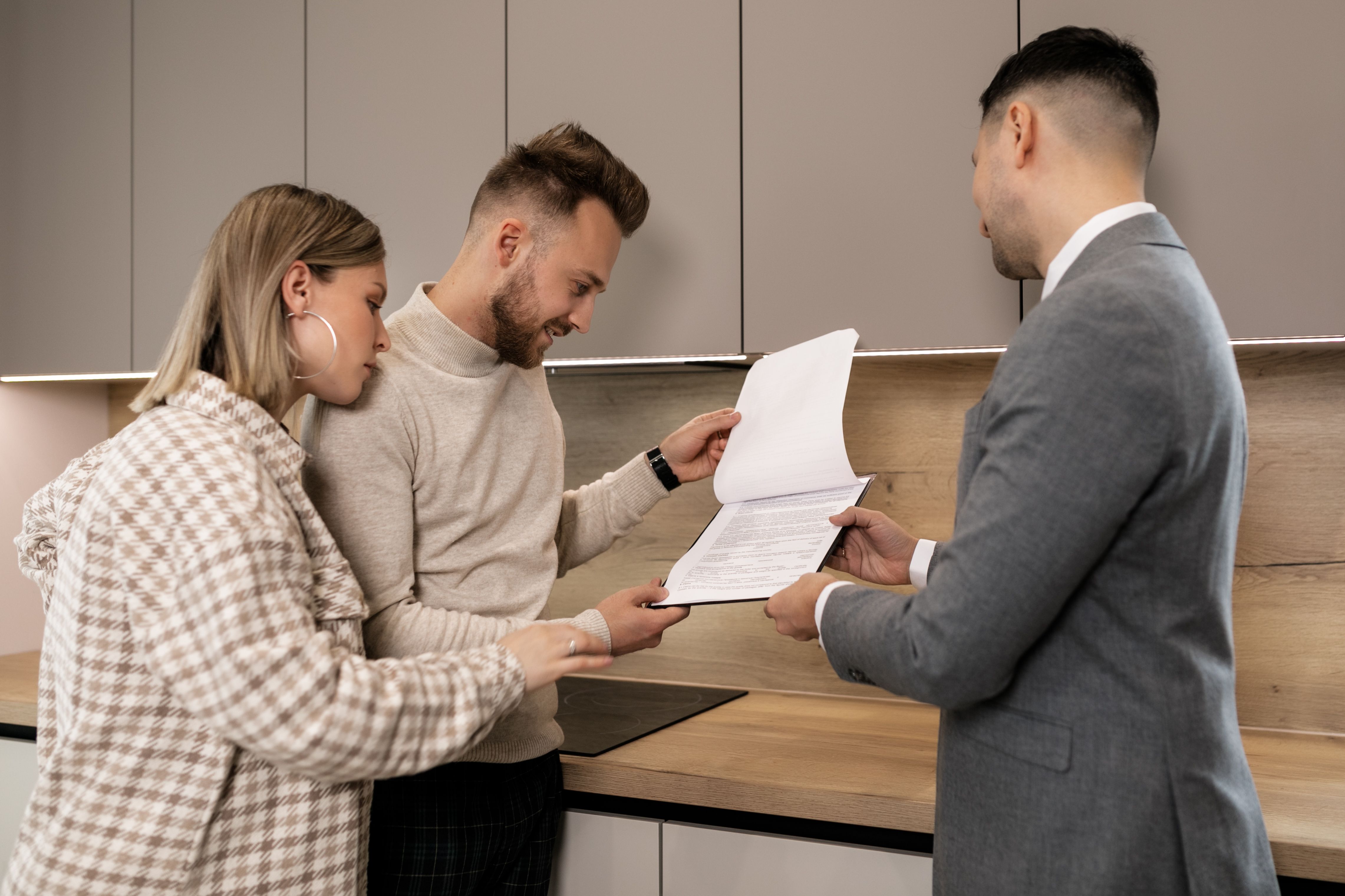 Real estate agent talking to clients