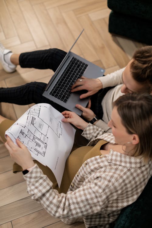 
A Couple Looking at a Blueprint