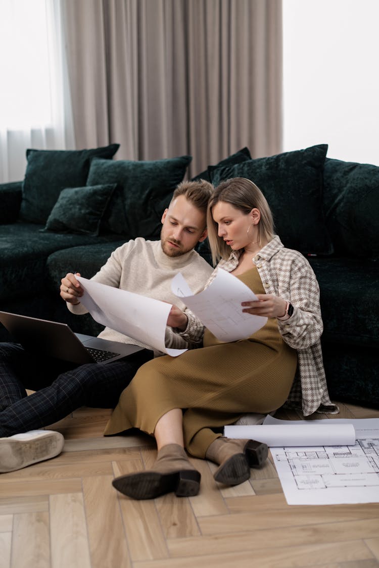 
A Couple Looking At Documents