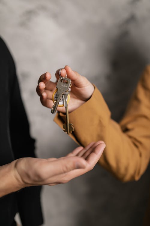 Free Giving Keys to a Buyer Stock Photo