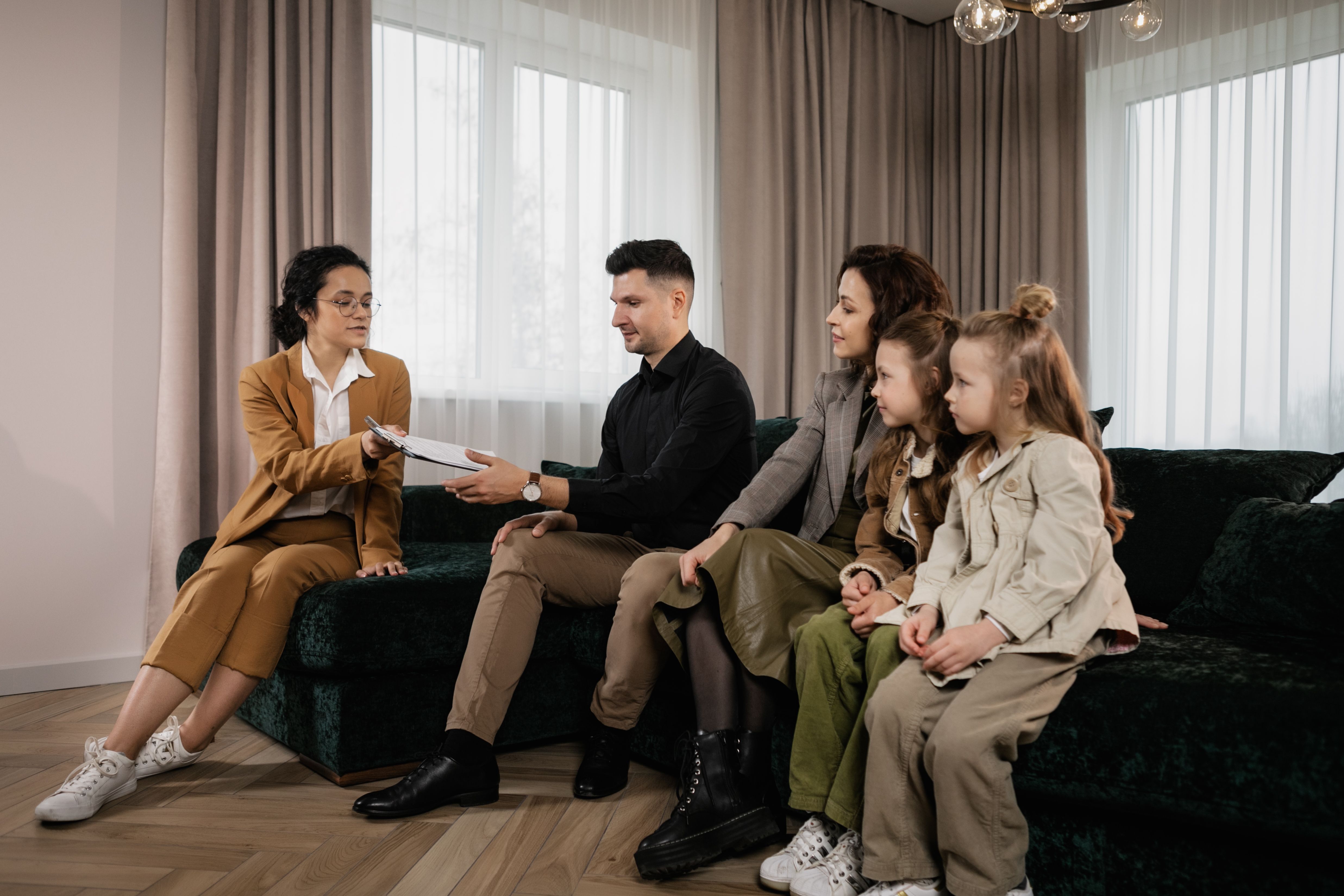 Image File Name: real-estate-guidance
Image Alt Text: Realtor discussing home purchase options with a family
Image Caption: Working with a veteran friendly real estate agent can help buyers evaluate builder incentives and long-term value.