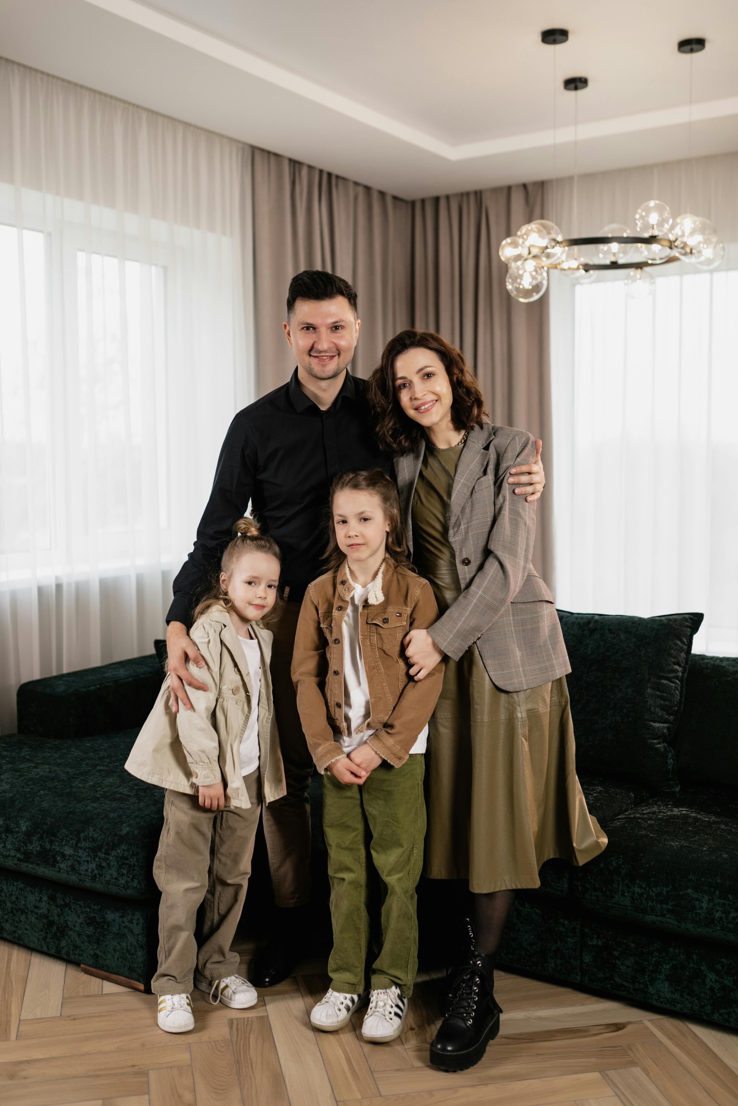 A smiling New Zealand cafe owner using a tablet POS system next to a modern EFTPOS payment terminal on a wooden counter.