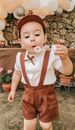 Cute boy blowing bubbles during holiday