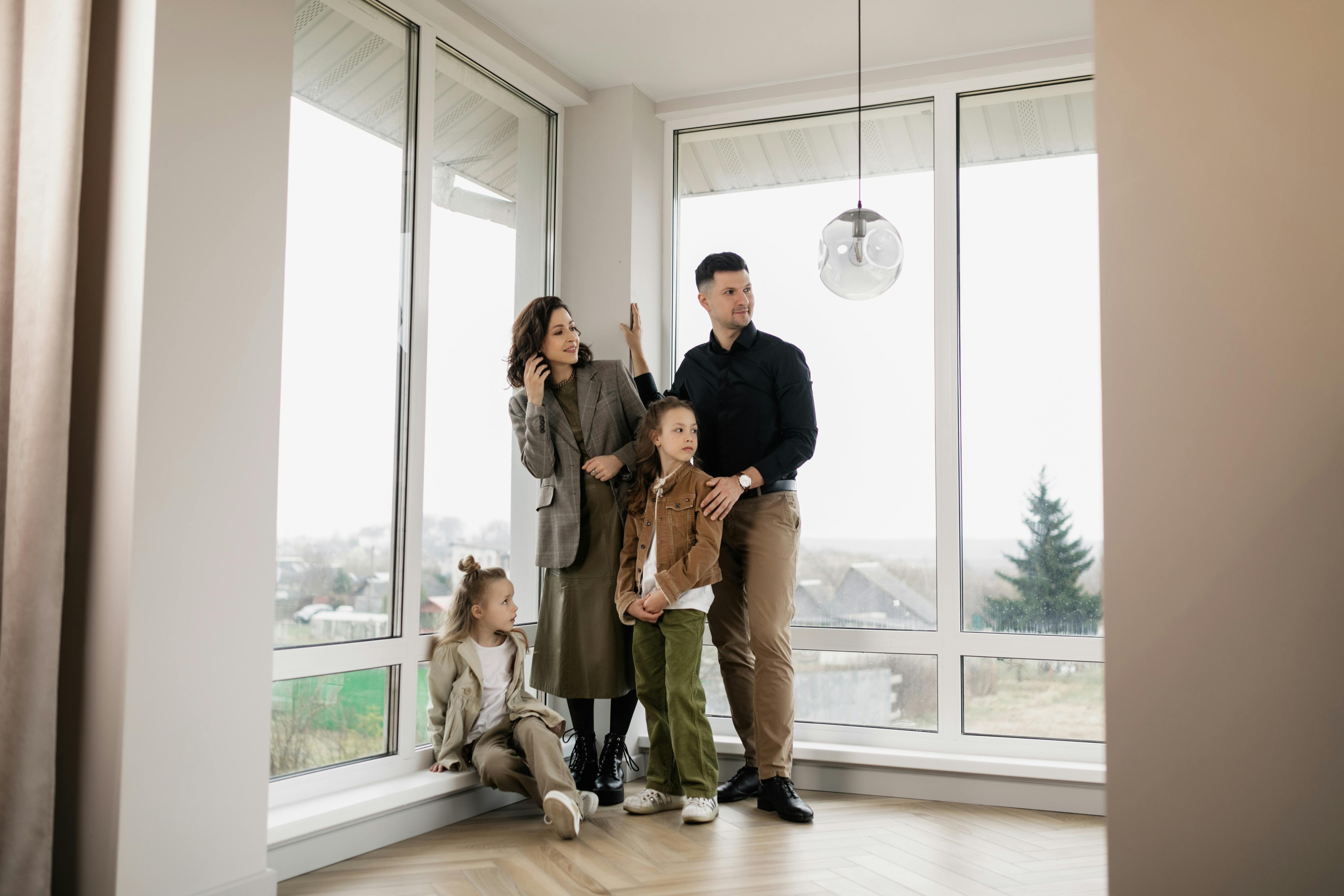 comfortable family in warm living room with snow outside window - boiler repair in south westminster co