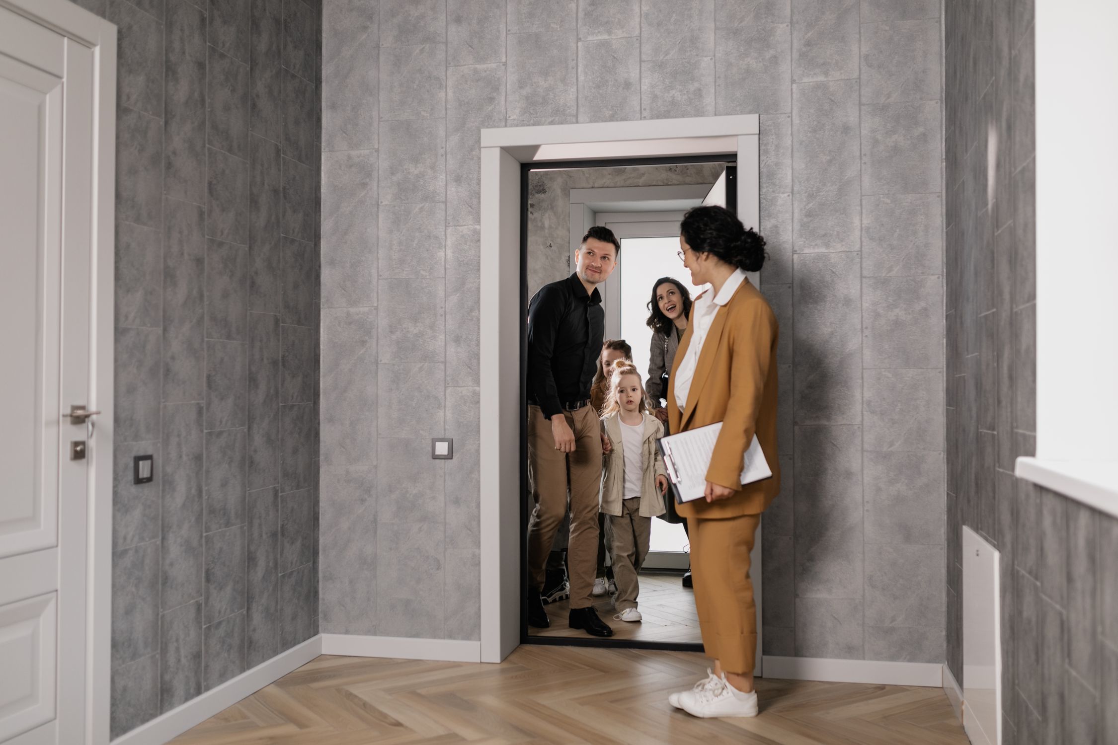 A Family Inside a House for a House Tour · Free Stock Photo