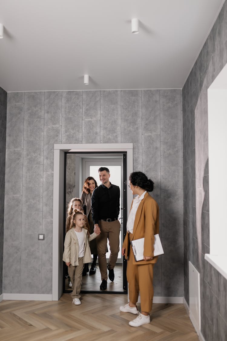 Smiling Family Entering Empty Room