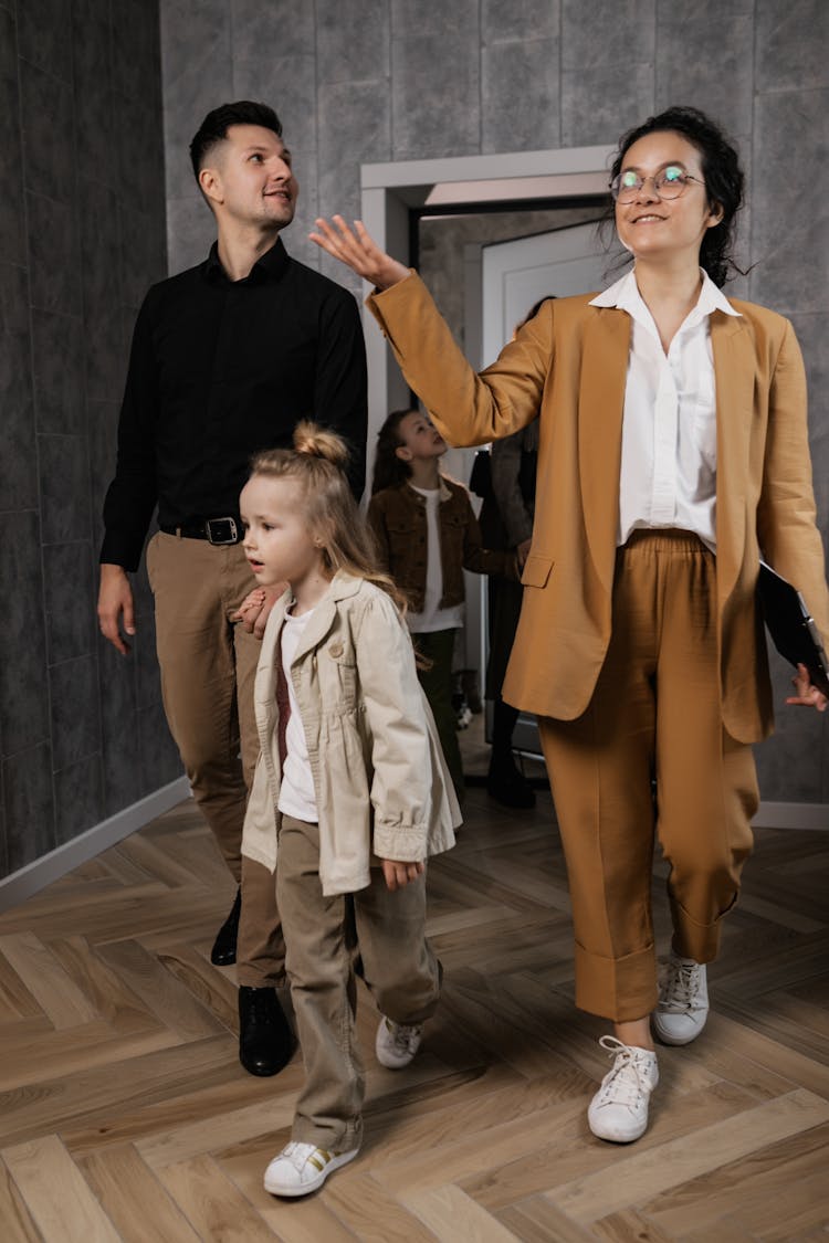 A Realtor Showing A House To A Family