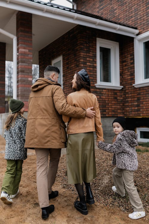 Free Family Walking Towards a House Stock Photo