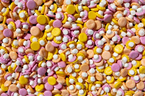 Free Vibrant assortment of colorful candy mushroom shapes creating a playful, eye-catching pattern. Stock Photo