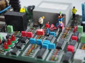 Miniature Human Figures in Motherboard