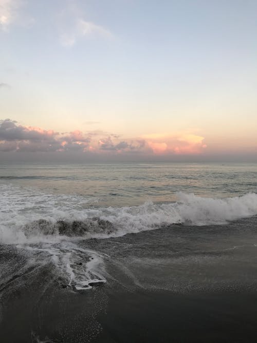 Ocean Waves Crashing on Shore during Sunset