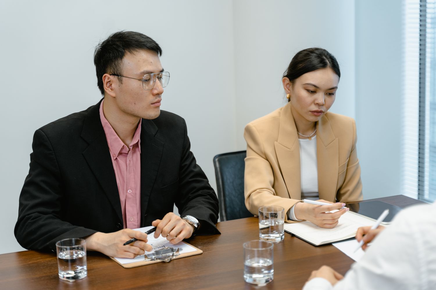 Executive hiring managers reviewing trial results with confident discussion