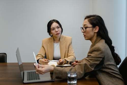 Free Businesswomen Discussing in a Meeting Stock Photo