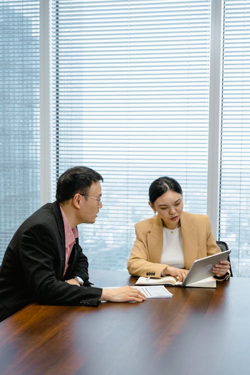 Free Man and Woman Having a Meeting Stock Photo