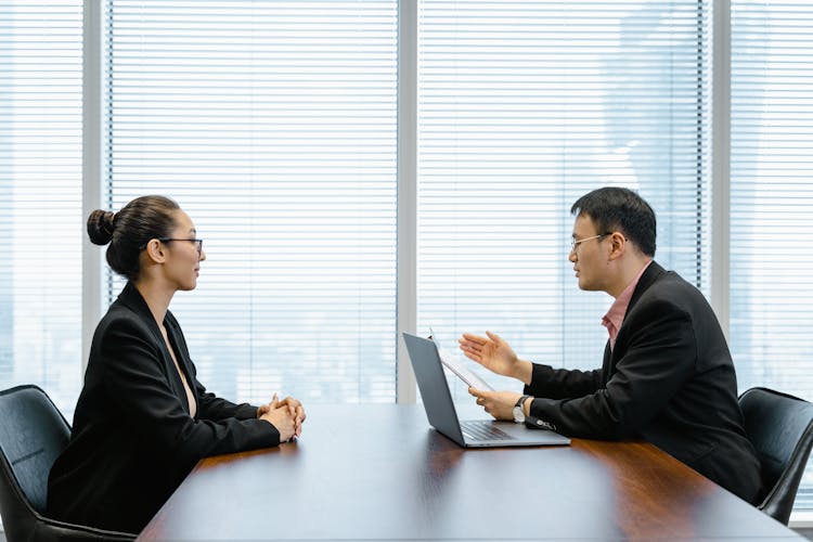 Man Interviewing A Woman