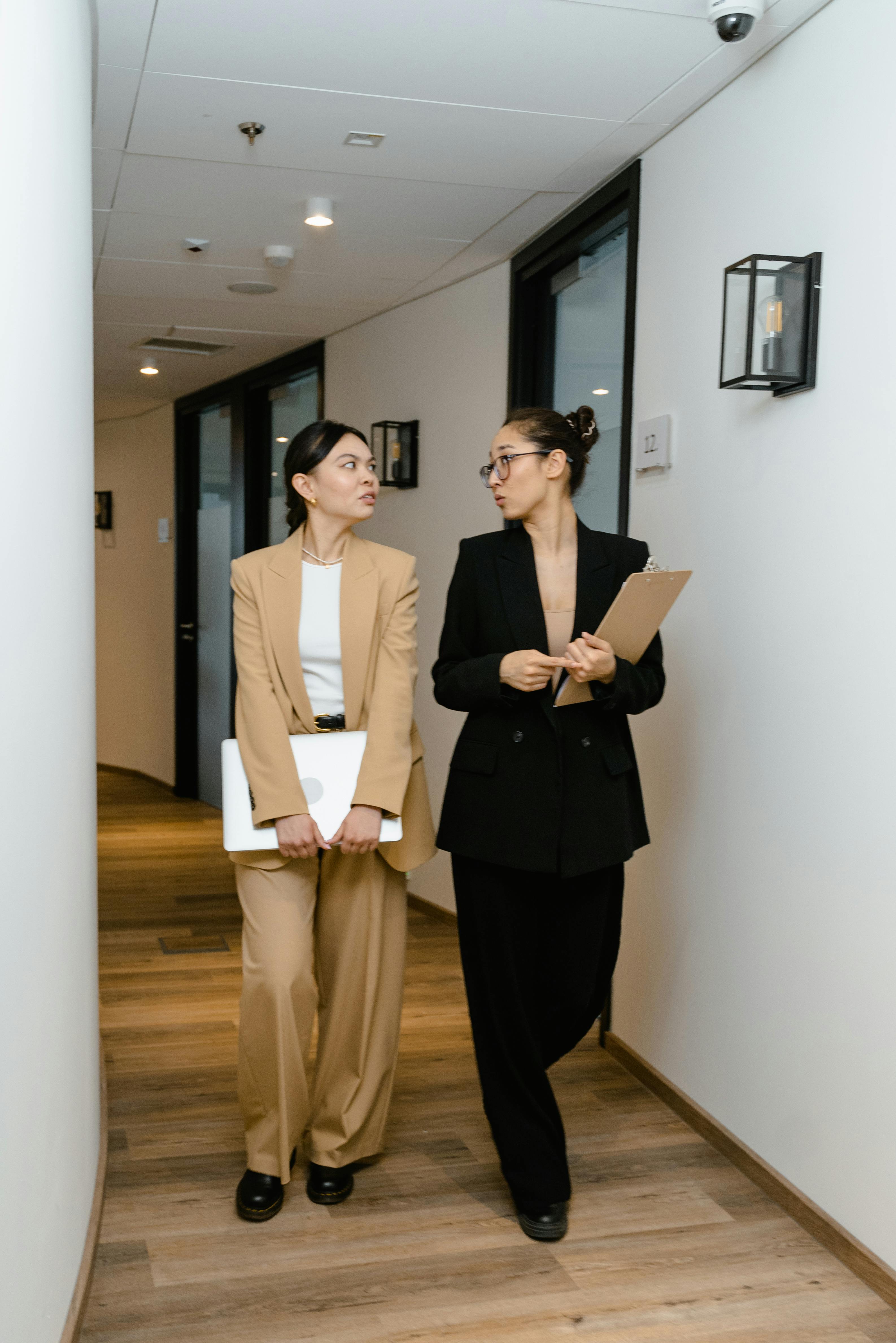 businesswomen walking in the hallway