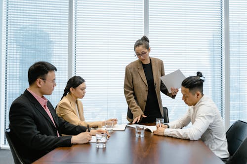 Free Colleagues Having a Discussion in the Meeting Room Stock Photo