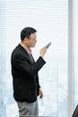 Man Recording Voice Message on Mobile Phone