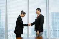 A Man and a Woman Shaking Hands