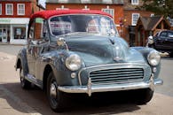 Vintage Silver Car Parked on Sidewalk