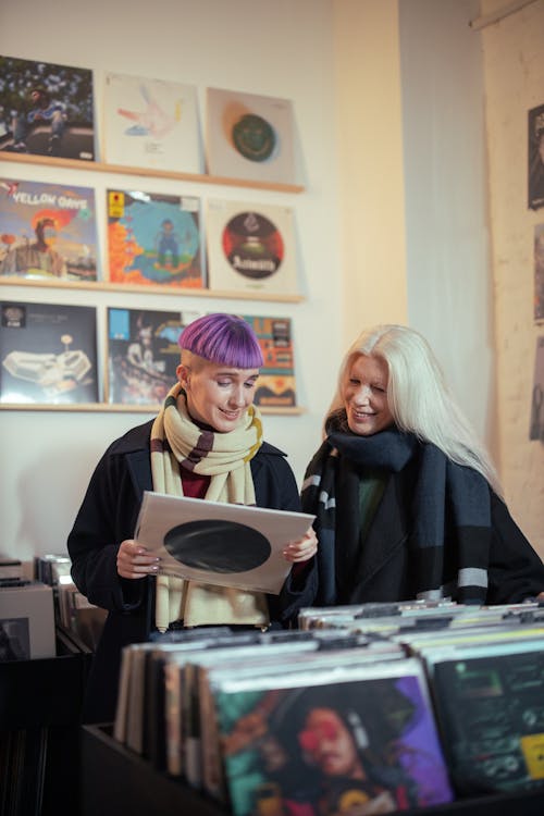 Mother and Daughter Looking at Vinyl Record