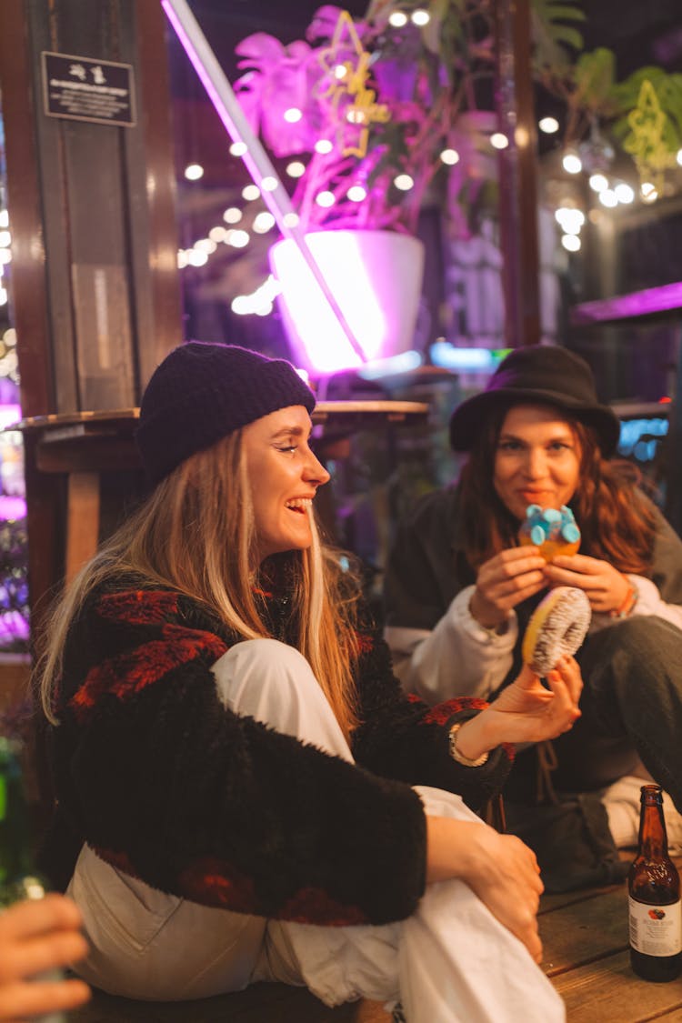 Happy Woman Holding A Donut