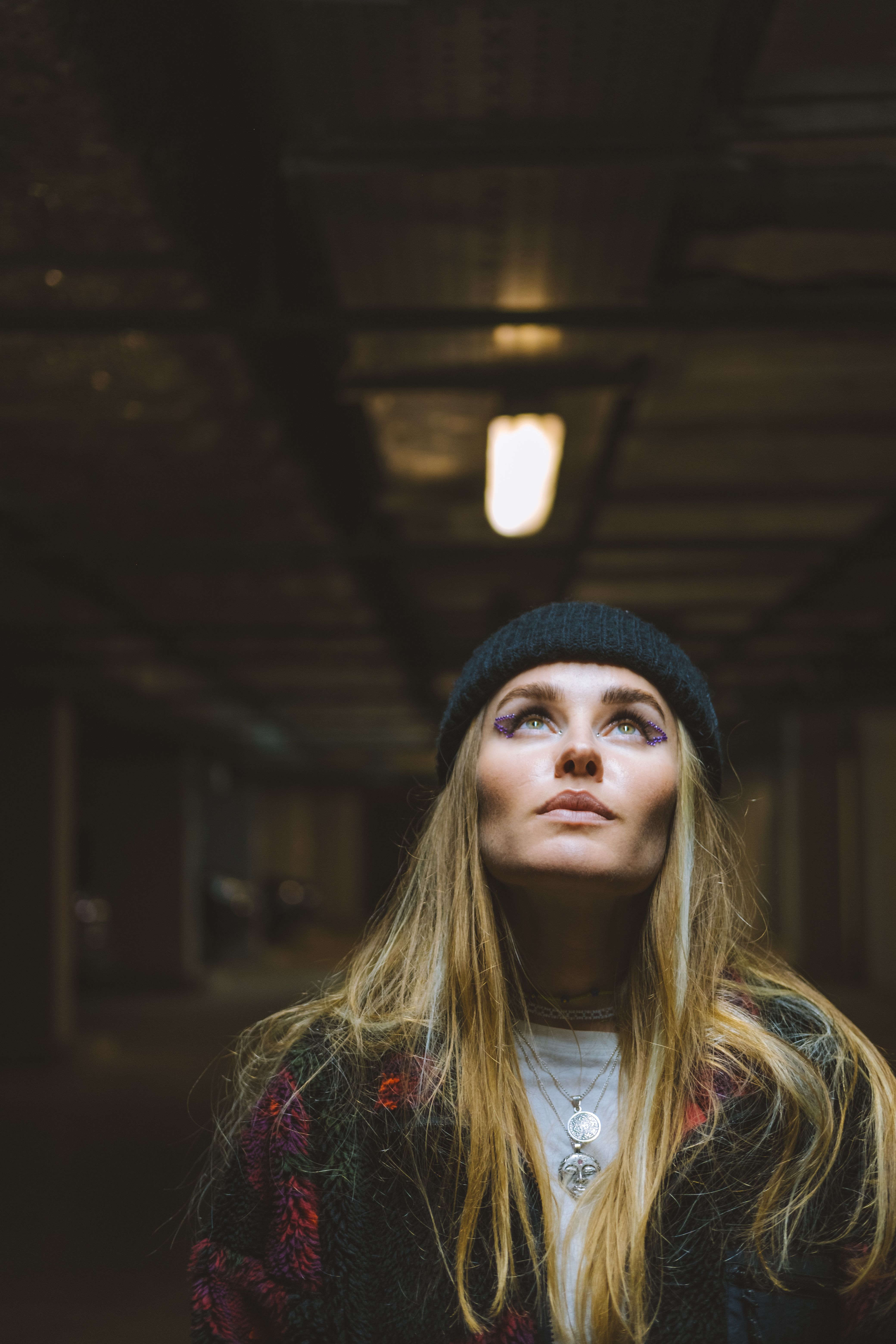 Woman in Black and Red Jacket Wearing Black Beanie Hat · Free Stock Photo