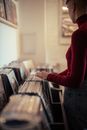 Person Standing in Front of Old Vinyl Records