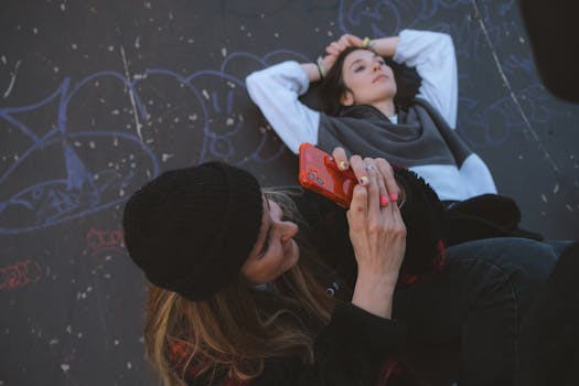 Young women capturing urban street moments with style and creativity.