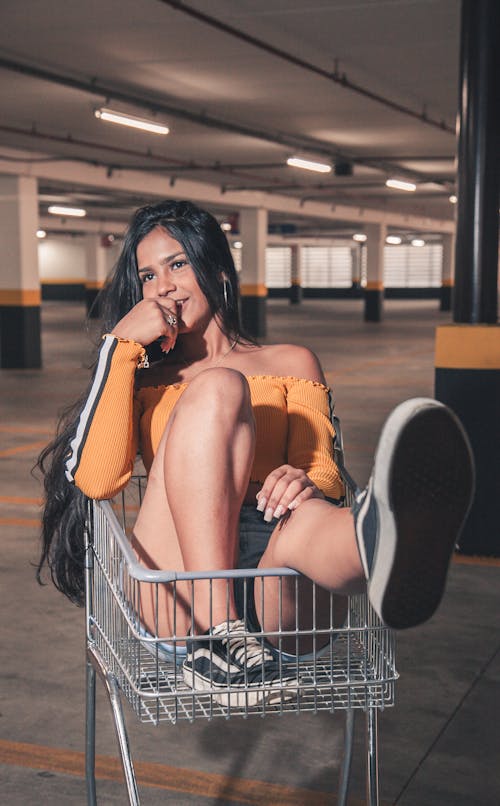 Beautiful Woman on a Shopping Cart