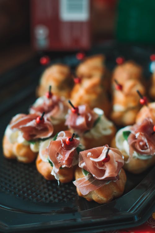 Delicious pastry decorated with prosciutto