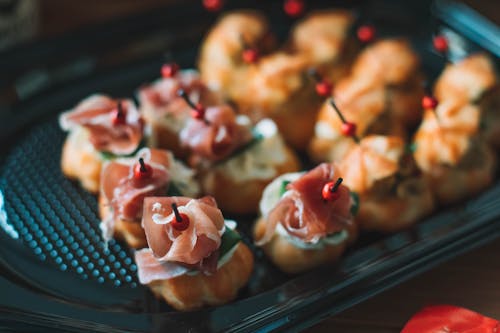 Delicious profiteroles with fresh prosciutto