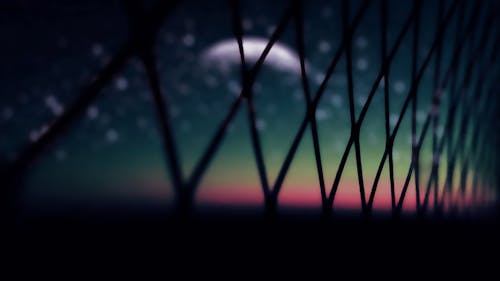 Free Black Link Wire Fence at Night Stock Photo